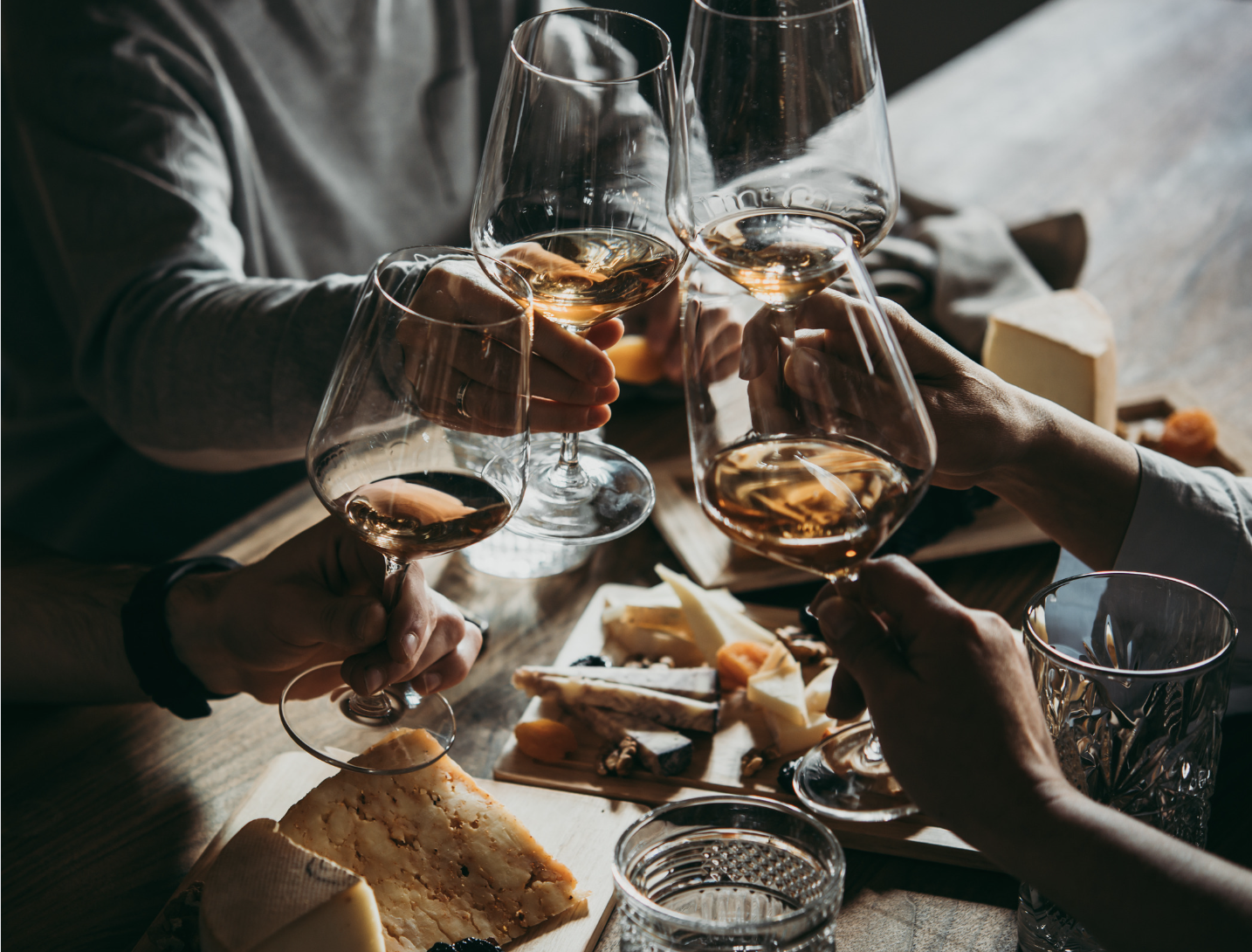 cheers with wine glasses filled with wine